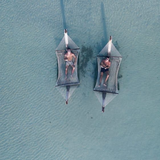 Two overwater hammocks seen from above