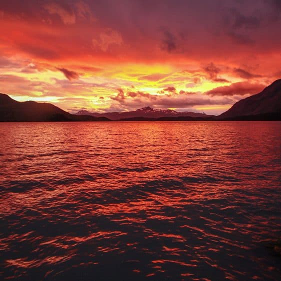 A fiery red sunset over the lake
