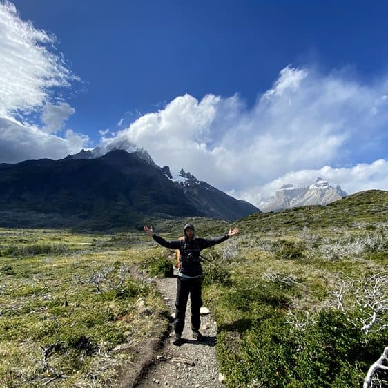 Billy with arms outstretched on the trail