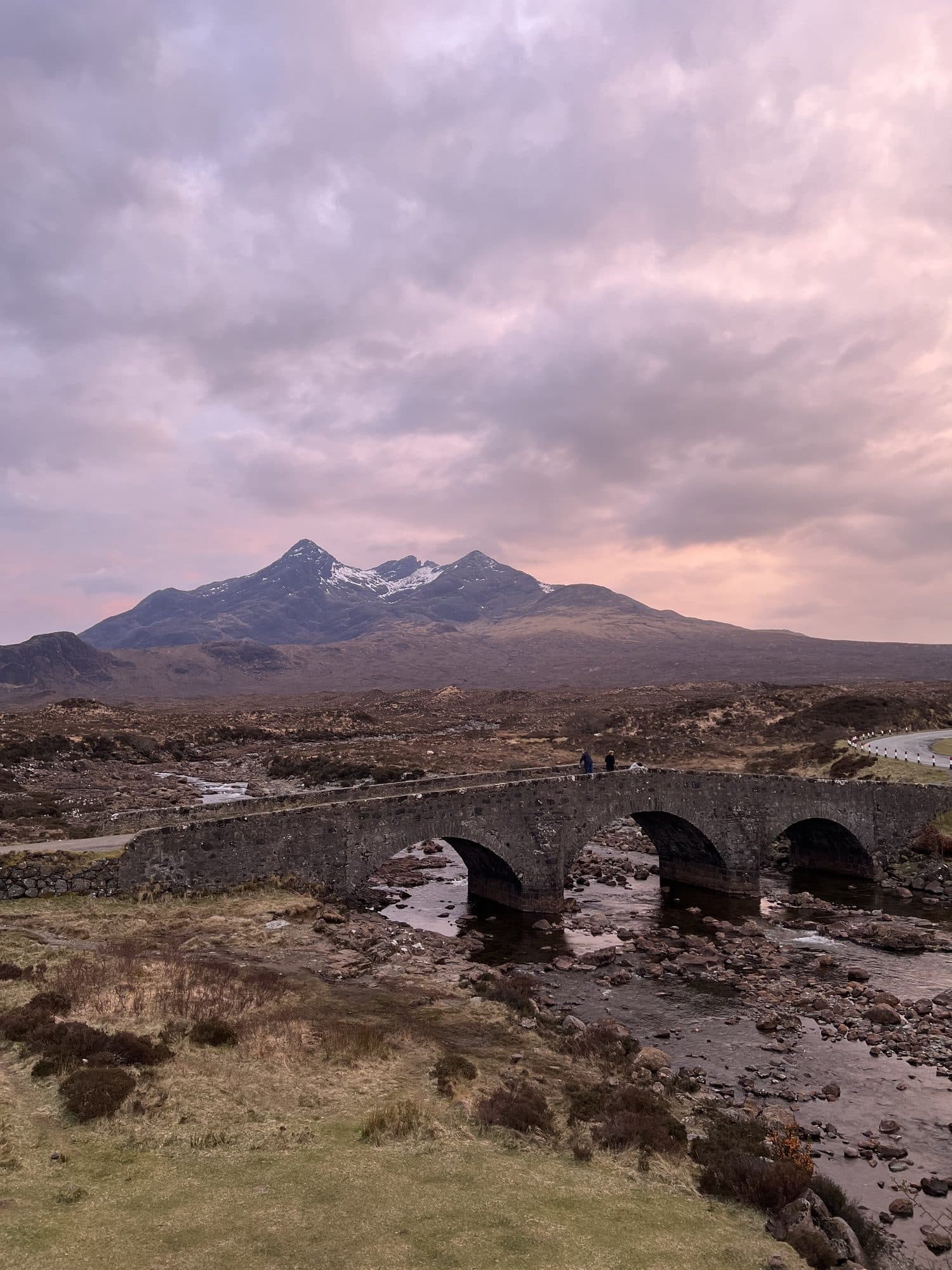 Sligachan Old Bridge under a pink sunset sky