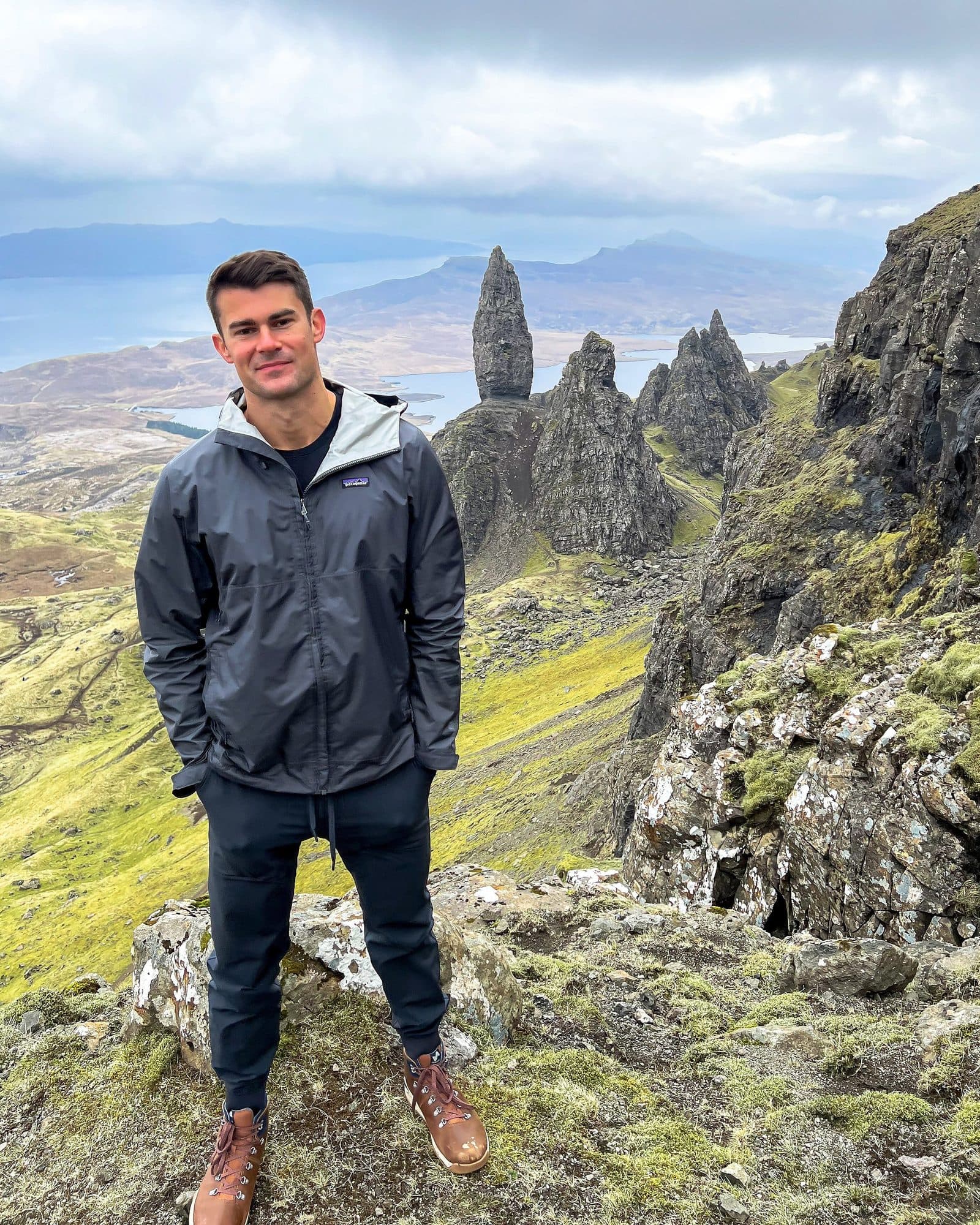 Billy standing below the Old Man of Storr