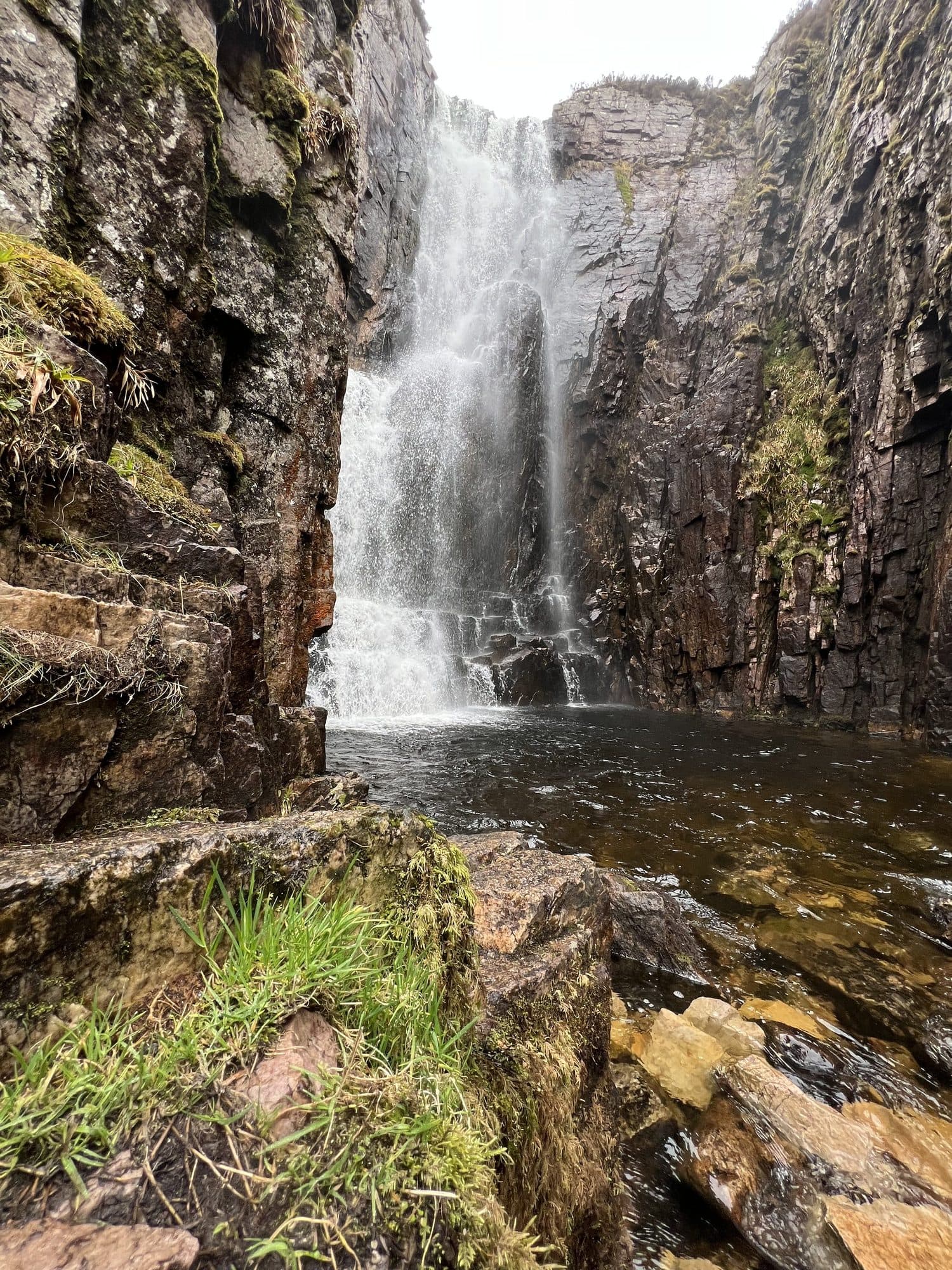 Wailing Widow Falls tucked into a rocky valley